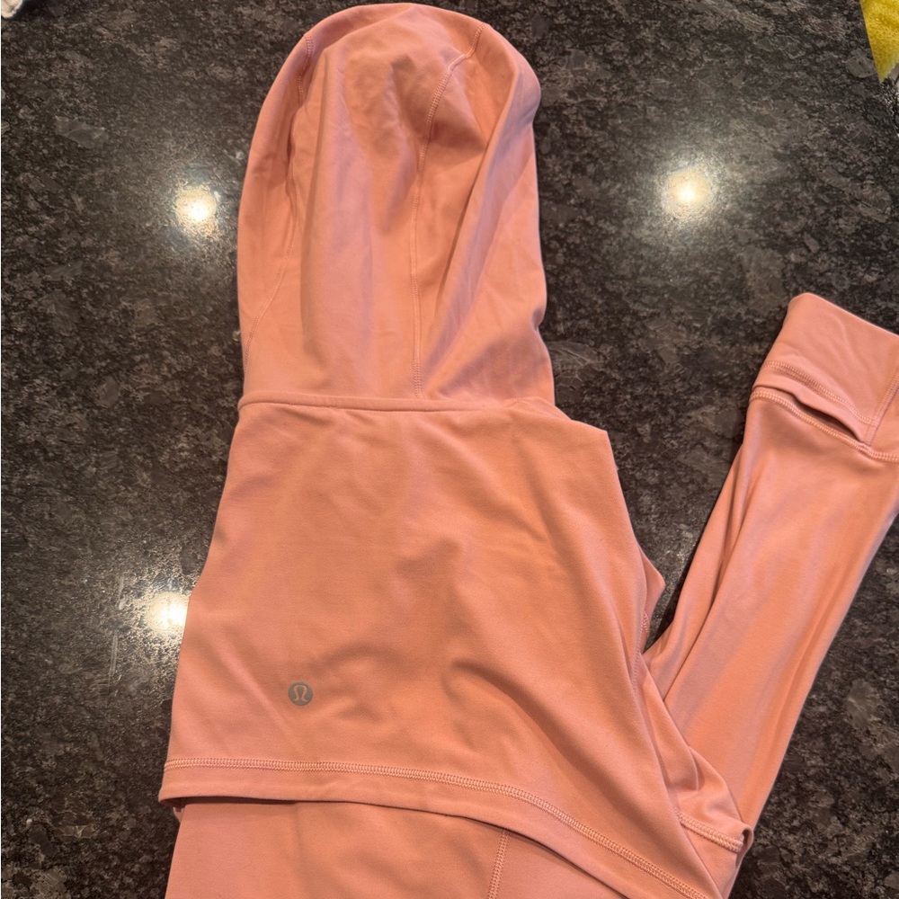 Pink lululemon nulu zip up jacket with hood and pockets. Size 12